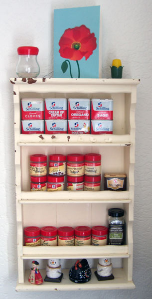 Photo of wooden spice rack with spices